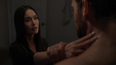 The human protagonist and the android share a tense, ambiguous moment.